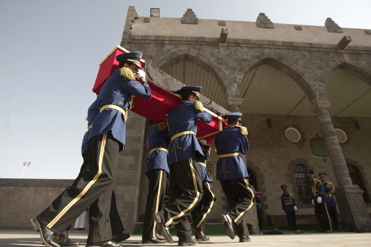 An honor guard carries the coffin of a soldier killed in an attack in the city of Aden during a funeral in Sanaa, Yemen, on Aug. 20, 2012.