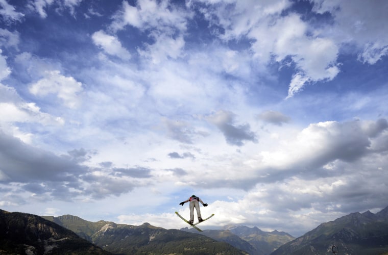 A skier competes during the 22nd edition of the summer ski jumping world cup Courchevel Grand Prix, on Aug. 15 in Courchevel, French Alps.