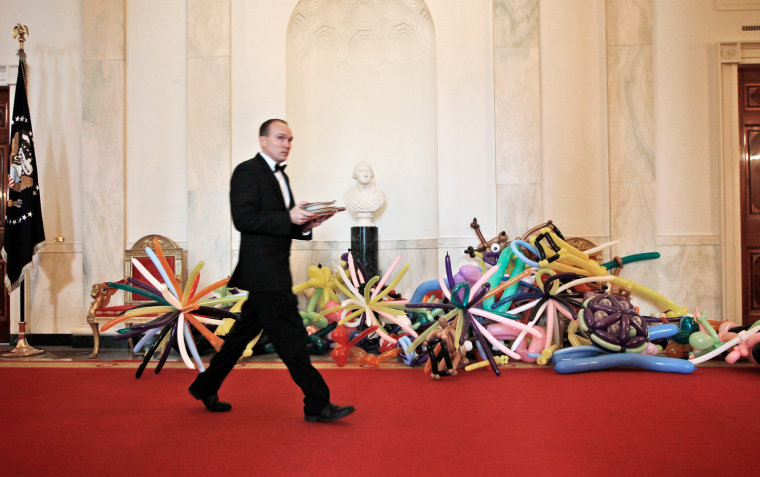 Party balloons sit on the floor of the Cross Hall of the White House in Washington, on Aug. 20, 2012, in preparations for the