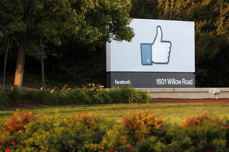 The sun sets on the entrance sign at Facebook's headquarters in Menlo Park, Calif.