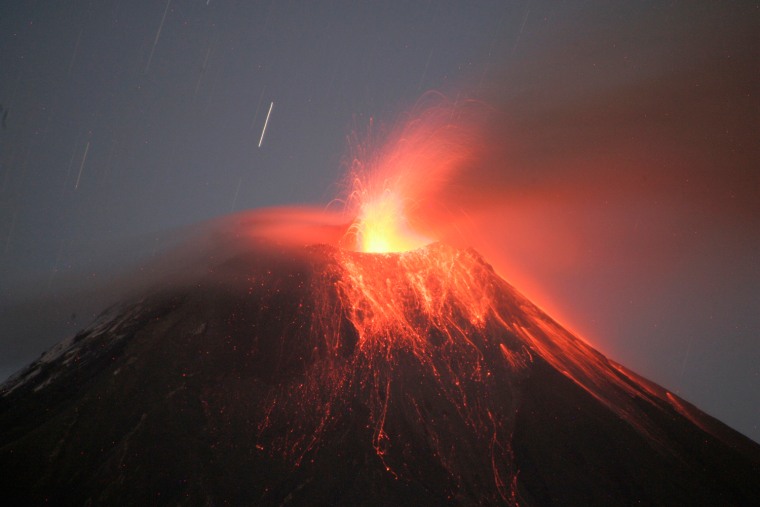 The volcano spews large clouds of gas and ash near Banos, about 110 miles south of Quito, on August 20, 2012.