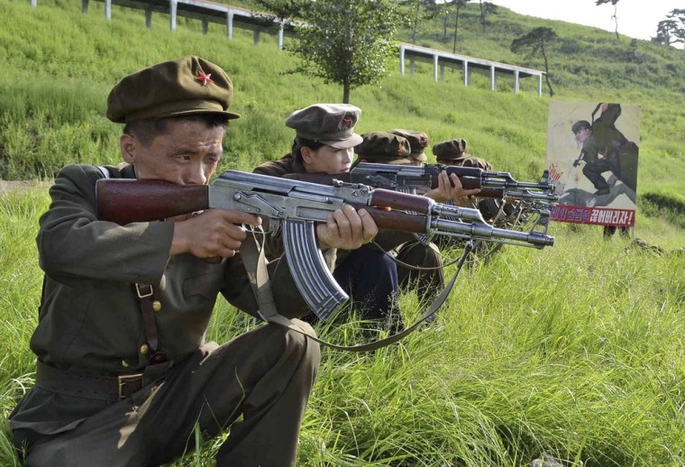 Members of the Worker-Peasant Red Guards, the civilian forces of North Korea, train in an undisclosed location on August 20, 2012, in this picture released by the official KCNA news agency on August 21, 2012.
