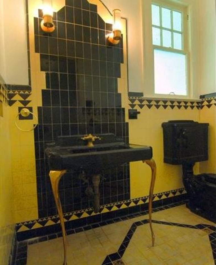 The downstairs powder room remains untouched from Capone's days.