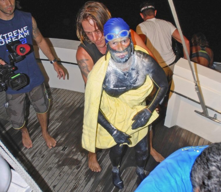 Endurance swimmer Diana Nyad is aided after she was pulled out of the water between Cuba and the Florida Keys early Tuesday.