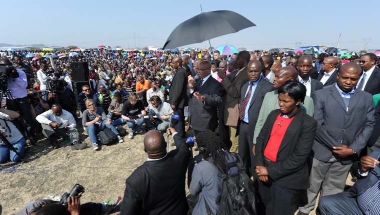South African President Jacob Zuma adresses Marikana miners as he visits the Nkaneng Informal Settlement on August 22 in Rustenburg, South Africa. The President visited Marikana in Rustenburg to address workers at platinum company Lonmin, following the the Marikana tragedy in which 34 striking miners were shot dead and another 78 were wounded by police last week. 10 people were also killed in the week before Thursday's shootings, including two police officers and two mine security guards. Zuma was joined by the inter-ministerial committee investigating the violence.