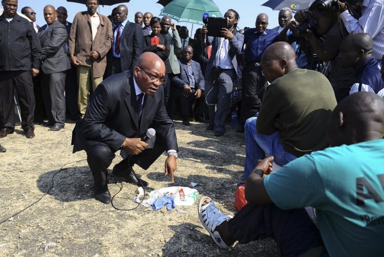 South African President Jacob Zumaspeaks to the leadership of striking Lonmin mineworkers during his visit to Marikana near Rustenburg, South Africa, Aug. 22.