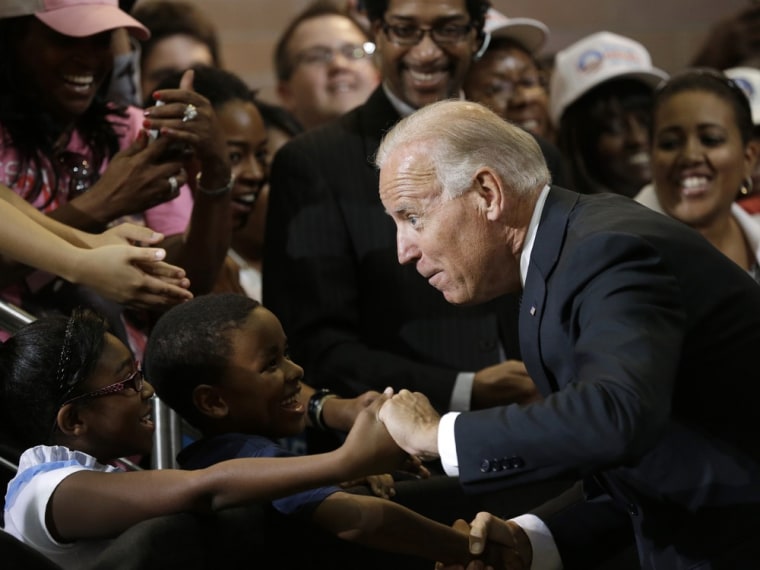 Vice President Joe Biden greets Lawrence Smith, 8, and Madison King, 9, both of Van Buren Township, Mich., during a campaign stop at Renaissance High School, Wednesday, Aug. 22, 2012, in Detroit.