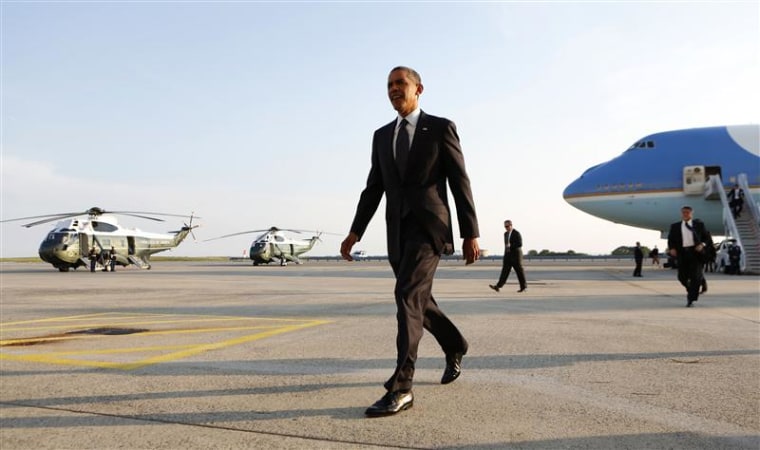 Barack Obama walks from Air Force One
