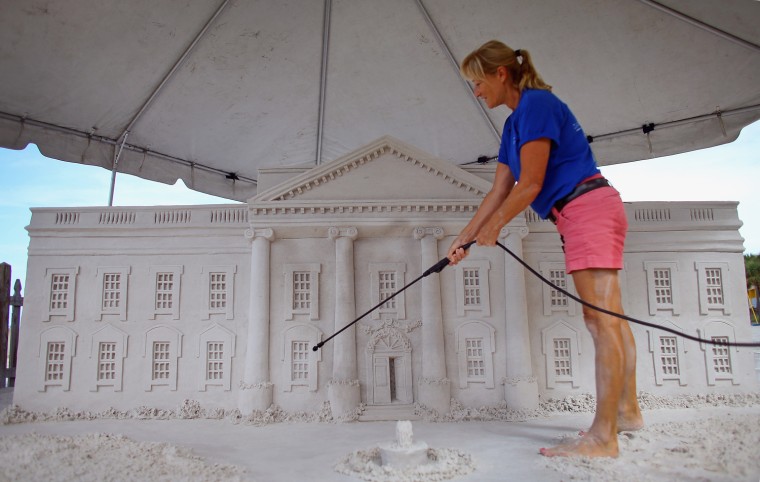 Artist Meredith Corson puts the finishing touches on a sand sculpture of the White House behind the Bilmar Beach Resort in Treasure Island, Fla., Aug. 23. The resort is also constructing sand sculptures of Abraham Lincoln & the Lincoln Memorial to coincide with the Republican National Convention, which starts in Tampa, Fla., next week.
