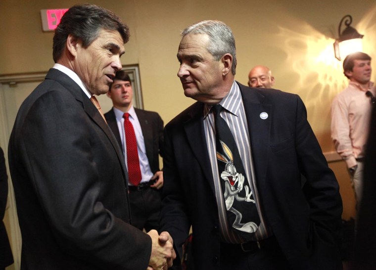 Lubbock County Judge Tom Head talks with Texas Governor Rick Perry in Lubbock, Tex. on May 8.