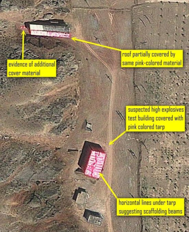 A satellite photo shows suspicious activity at the Parchin site, an Iranian complex that may have been used for weapons testing. The new image, taken on Aug. 15, shows what appears to be pink tent-like material draped over two buildings in an apparent attempt to hide sanitization or other activity there from satellite cameras.