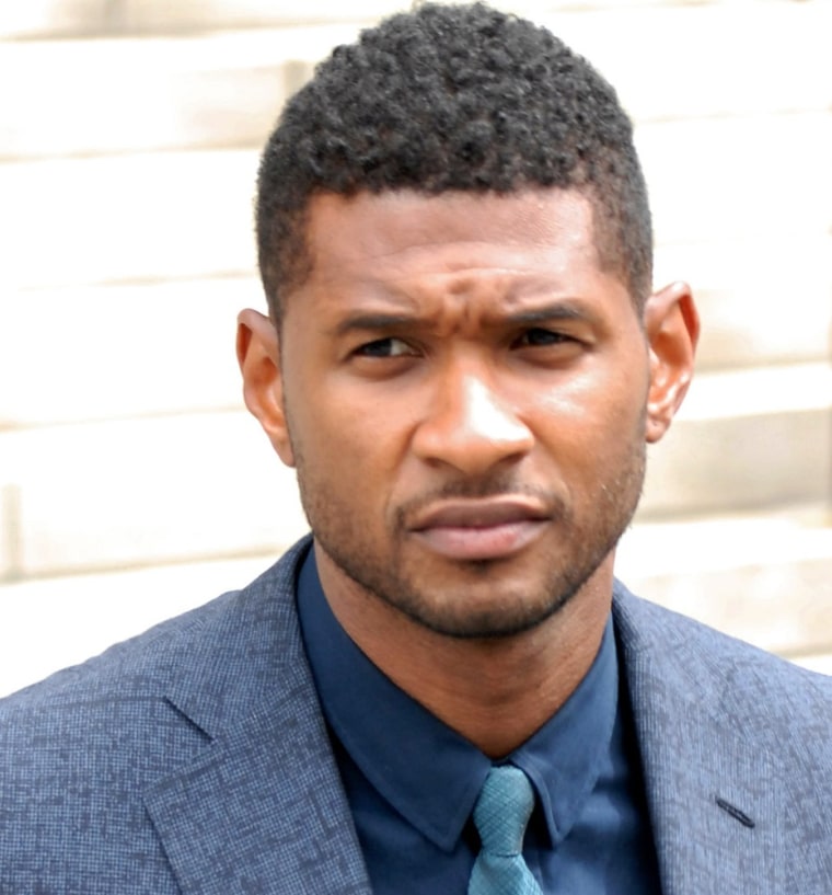 Usher Raymond at a hearing to discuss child custody with his ex-wife Tameka Foster at Fulton County State Court on Aug. 15, 2012 in Atlanta, Ga.