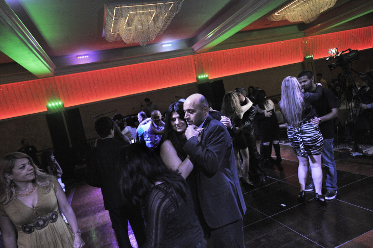 Samad and Dina Jabbo dance at a banquet organized for the Iraqi community in El Cajon, Calif. Samad, 40, his wife Dina, 37, and their daughters Monica, 16, and Milano, 12, and son Antonio, 7 months, arrived in the United States in June 2010 after living in Damascus, Syria, for four years. They are Christians from Baghdad and have green cards. They felt their lives were in danger when they lived in Iraq.