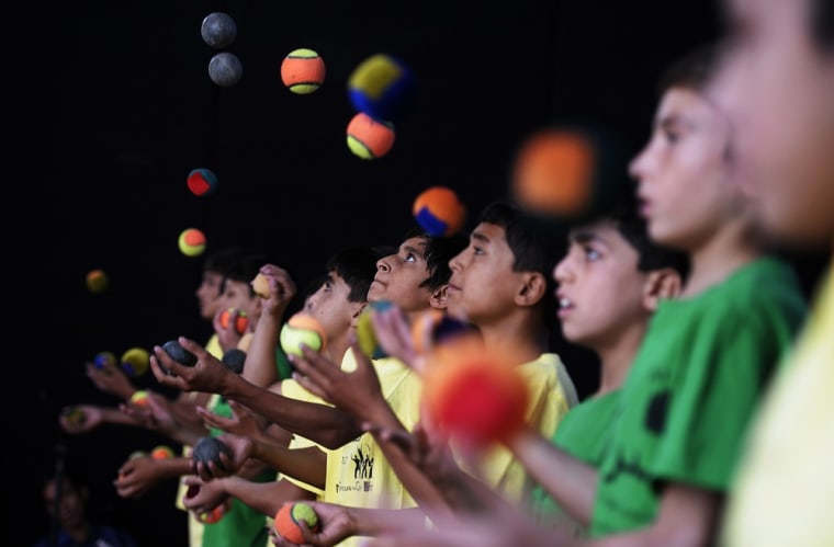 Afghan jugglers preform during the 7th Afghanistan Juggling Championships in Kabul.