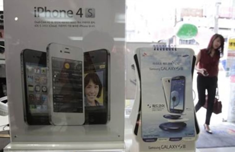Samsung Electronics' Galaxy S III phones are displayed at a shop in Seoul, South Korea, Monday, Aug. 27, 2012.