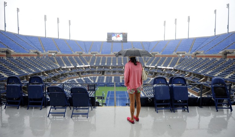 Rain falls on center court after play was suspended on the first day of the 2012 US Open Tennis Championship at the USTA National Tennis Center in Flushing Meadows, New York.