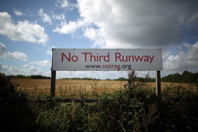 A sign is displayed at the village of Sipson, which would be demolished should a third runway be built, near Heathrow Airport on Aug. 28, in London, England.Transport Secretary Justine Greening has stated that the Government remains opposed to the building of a third runway at London's Heathrow airport despite calls from some Conservative Members of Parliament for the coalition to reconsider.