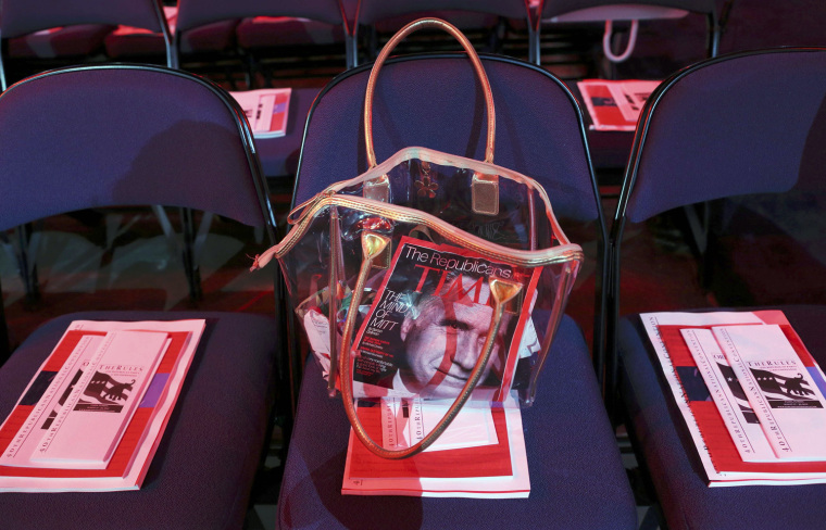 A purse containing the latest issue of Time magazine, with Republican presidential candidate Mitt Romney on the cover, is seen during the second day of the Republican National Convention in Tampa, Florida ON Aug. 28.