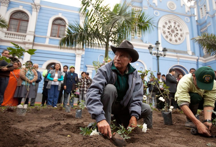 Two men plant rosebushes in memory of the victims of the two-decade fight between the military and Shining Path rebels, at a memorial in Lima, Peru, on Aug. 28. Between 1980 and 2000 tens of thousands of Peruvians died during the Maoist-inspired Shining Path insurgency.
