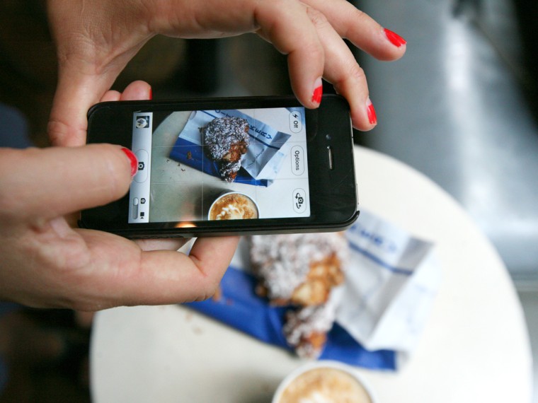 Photographer Nicole Franzen take a photo at New York City's City Bakery with her iPhone.