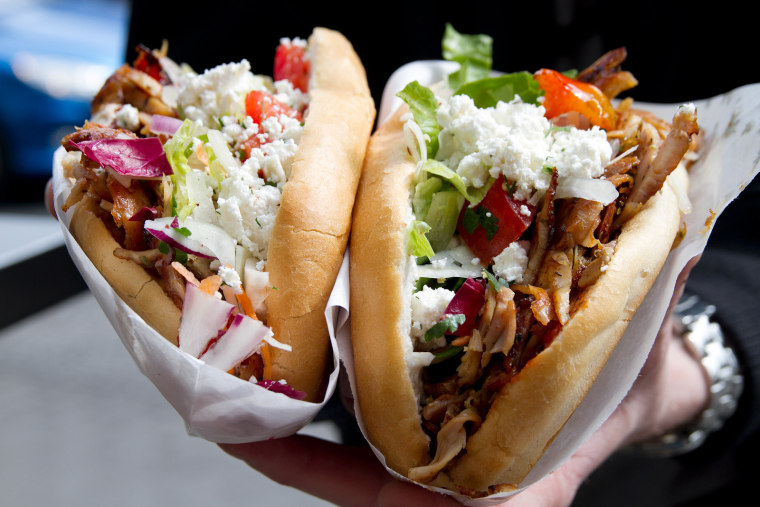 The Doner Kebab at Mustafa's Gemüse Kebap in Berlin is prepared lamb, sliced from a roasting spit, with deep fried veggies, feta cheese, lemon and sauces in bread.