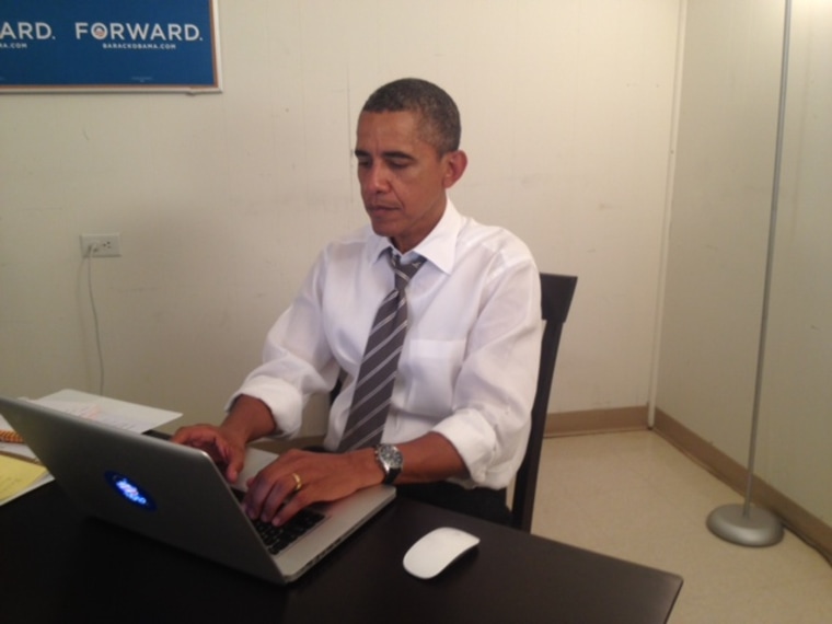 President Barack Obama is seen at the keyboard in a photo submitted to Reddit as part of the website's \"ask me anything\" live chat verification process.