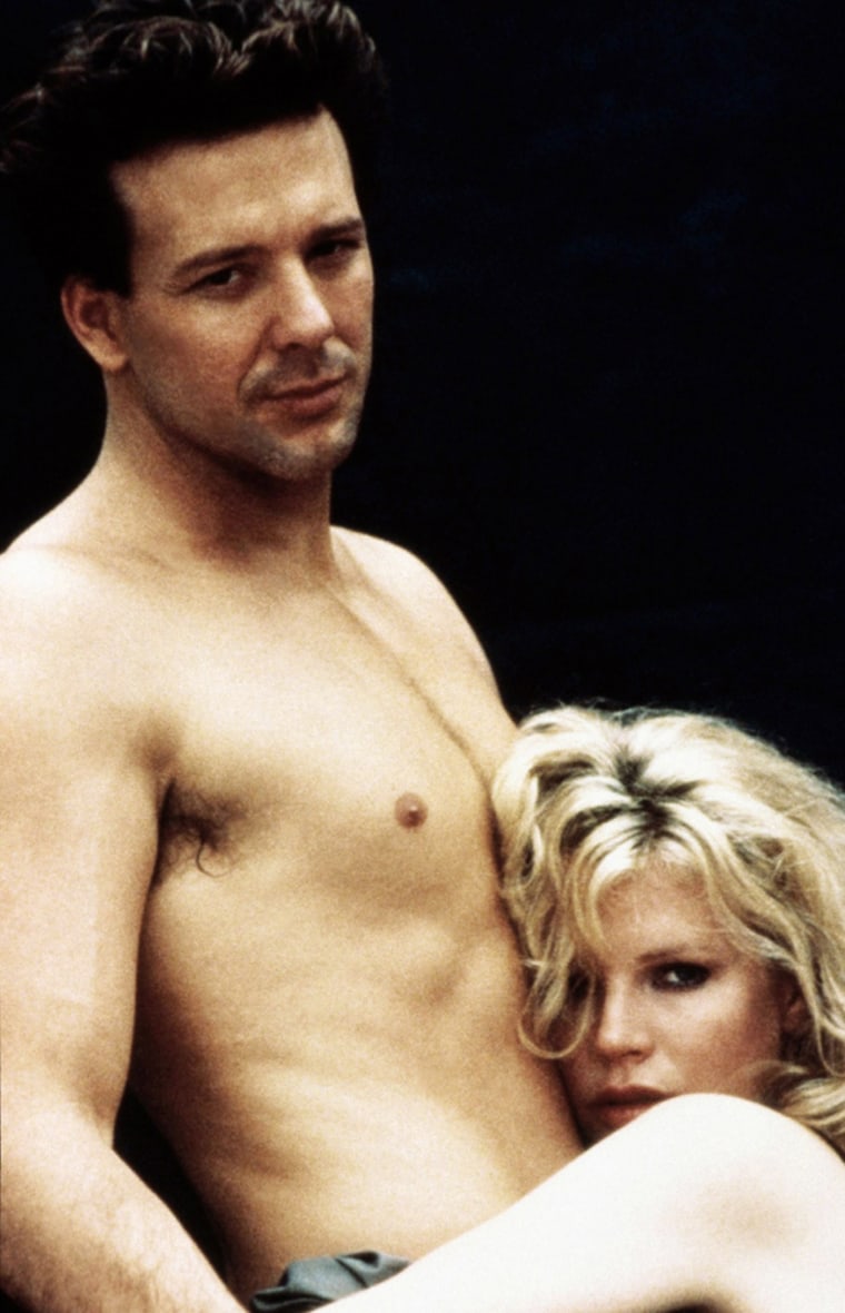 Mickey Rourke and Kim Basinger in the 1986 film \"9 1/2 Weeks.\"