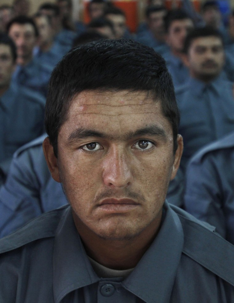 Afghan national police officers attend their graduation ceremony.