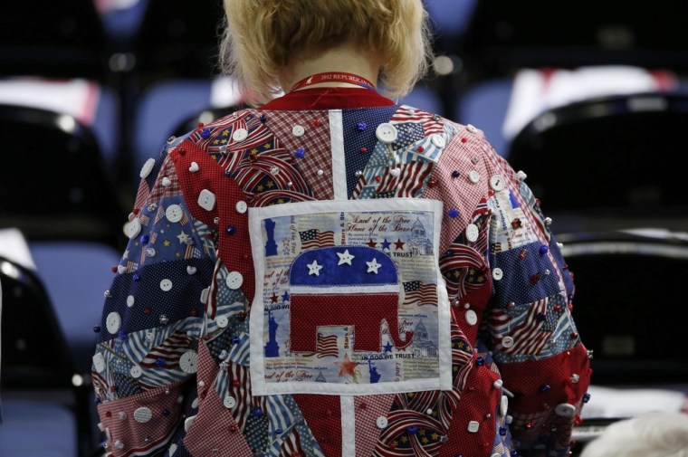 A delegate wearing a quilt shirt walks to her seat at the Republican National Convention in Tampa, Florida, August 28.