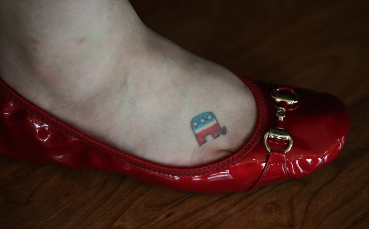 Brittany Edwards of West Memphis, Arkansas shows off her GOP logo tattoo on her foot that she's had for five years during the Republican National Convention, Aug. 29.
