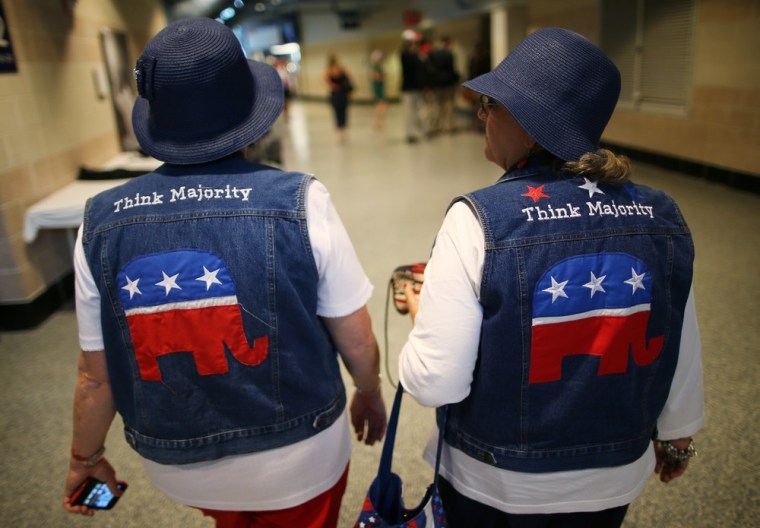 Pat Tippett of Baxley, Georgia and Linda Dennison of Blackshear, Georgia, wear GOP logo cut-off jean jackets with matching blue hats during the Republican National Convention, Aug. 29.