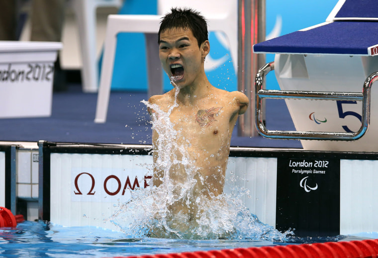 Tao Zheng of China celebrates winning the men's 100m backstroke final on Aug. 30.