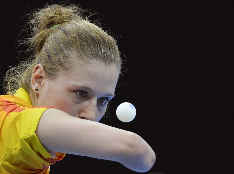 Natalia Partyka of Poland serves during her women's singles C10 table tennis classification match against Umran Ertis of Turkey Aug. 30. Partyka has won gold medals in both the 2008 Beijing Olympics and the 2004 Athens Olympics, and she is also the only female athlete to compete in both the London 2012 Olympic and Paralympic Games.