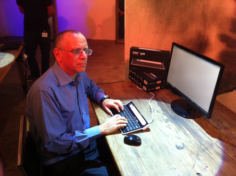 Dov Moran demonstrates the Smartype keyboard.