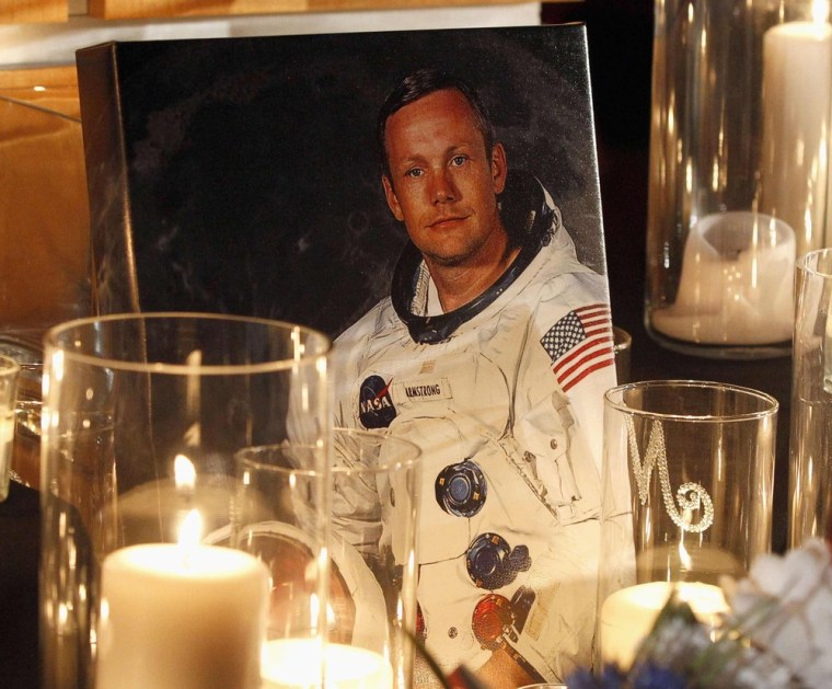 A portrait of Neil Armstrong is displayed during a public memorial service at the Armstrong Air and Space Museum in Wapakoneta, Ohio, on Wednesday. Armstrong was born in Wapakoneta in 1930. Hundreds gathered at the museum for Wednesday's service. More about the service from The Lima News.