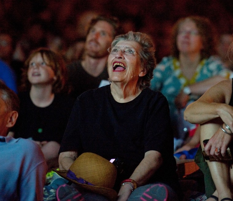 Melisande Charles of St. Paul, Minn., center, sits in the audience.