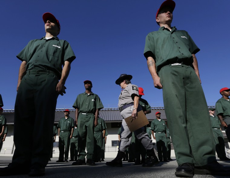 Correctional officer Juleigh Walker inspects inmates during morning formation at the Moriah Shock Incarceration Correctional Facility on Aug. 22, in Mineville, N.Y.