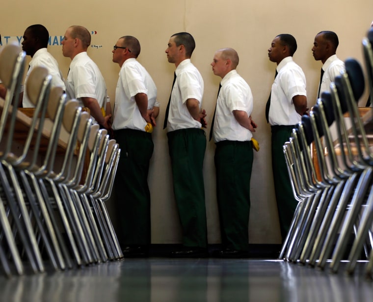 Inmates line up for lunch at the Moriah Shock Incarceration Correctional Facility on Aug. 22, in Mineville, N.Y.