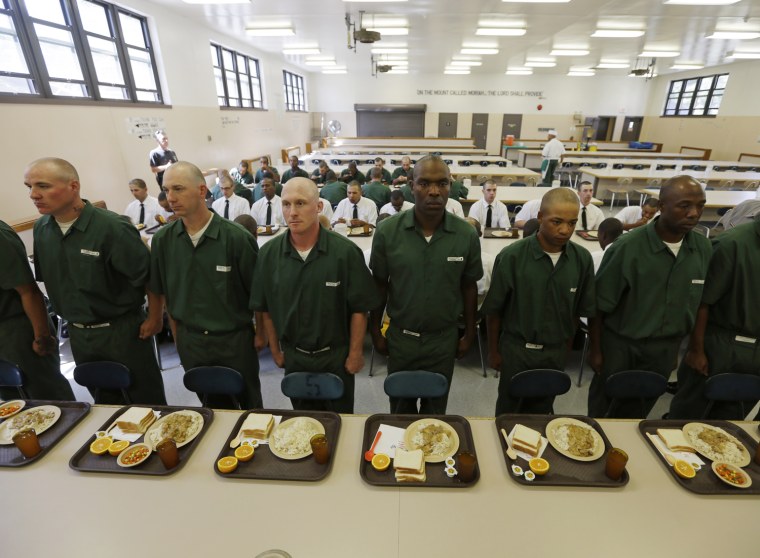 Inmates wait to eat lunch at the Moriah Shock Incarceration Correctional Facility, on Aug. 22, in Mineville, N.Y.