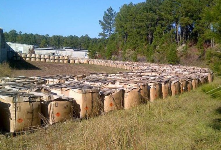 This photo released by the Louisiana State Police shows piles of explosive powder that authorities at the Camp Minden industrial site in Doyline, La.