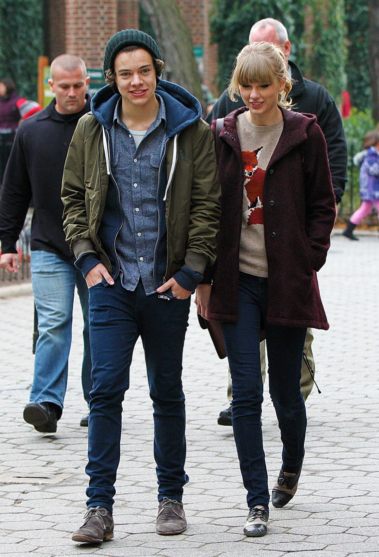 Taylor Swift, right, and Harry Styles of One Direction are seen leaving the Central Park Zoo in New York.
