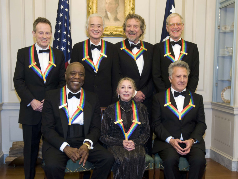 The 2012 Kennedy Center Honorees, from left, John Paul Jones, Buddy Guy, Jimmy Page, Natalia Makarova, Robert Plant, Dustin Hoffman, and David Letterman pose for a group photo after the State Department Dinner for the Kennedy Center Honors in Washington on Saturday.