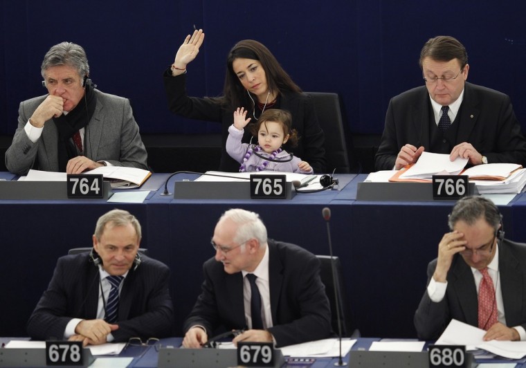 Italy's Member of the European Parliament Licia Ronzulli takes part with her daughter in a voting session at the European Parliament in Strasbourg, France February 15.