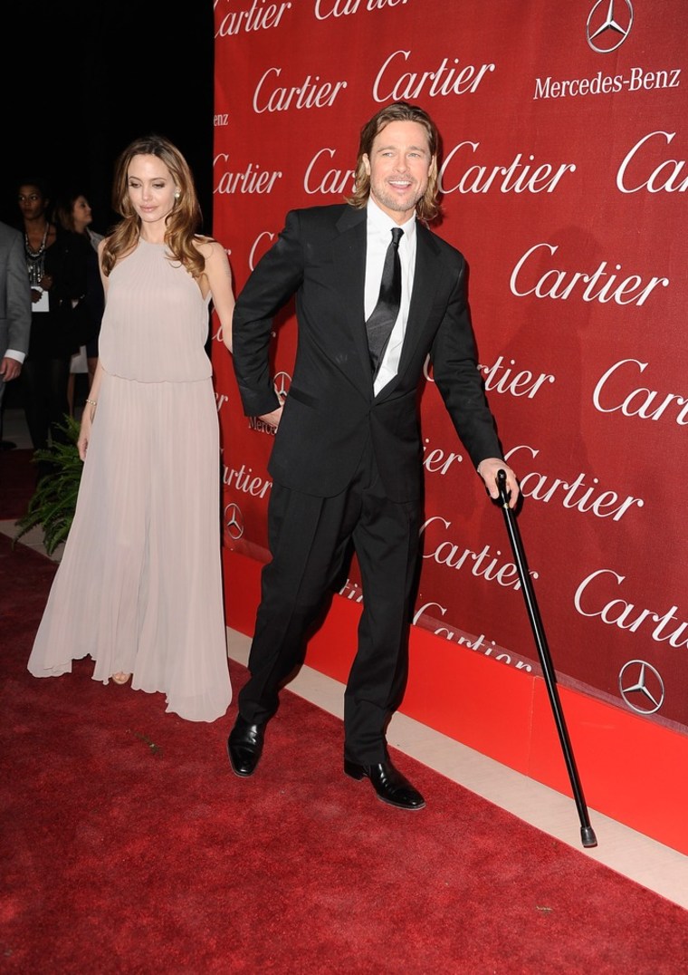 Brad Pitt hit the red carpet with a cane after a kid-induced injury.