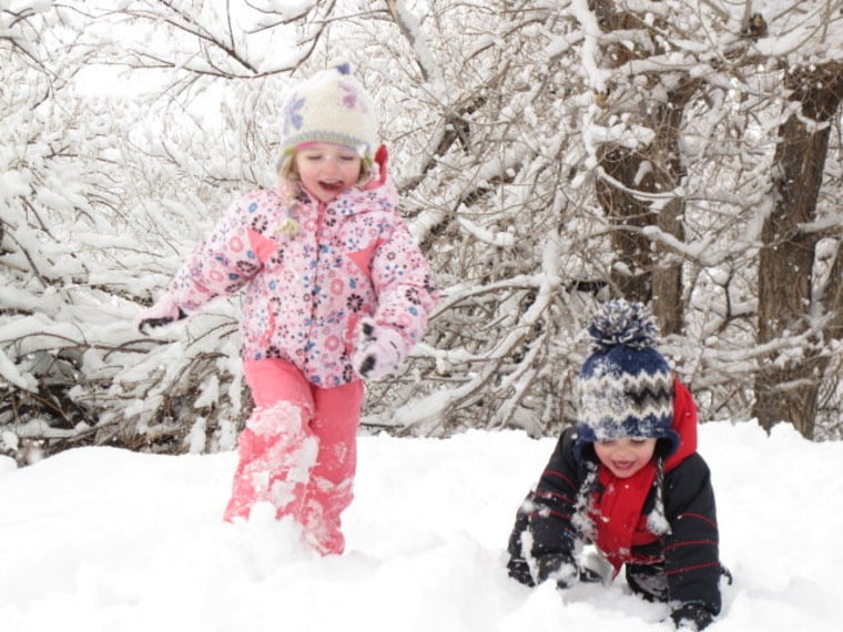 Makenzie and Zachary are joyful in the snow.