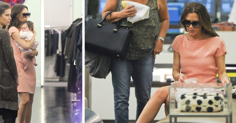 Victoria Beckham changes Harper Beckham's diaper in Marc Jacobs Soho in New York City.