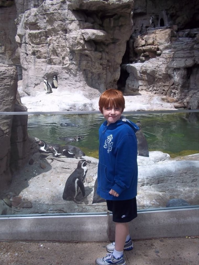 Brett, age 8, hanging with the penguins.