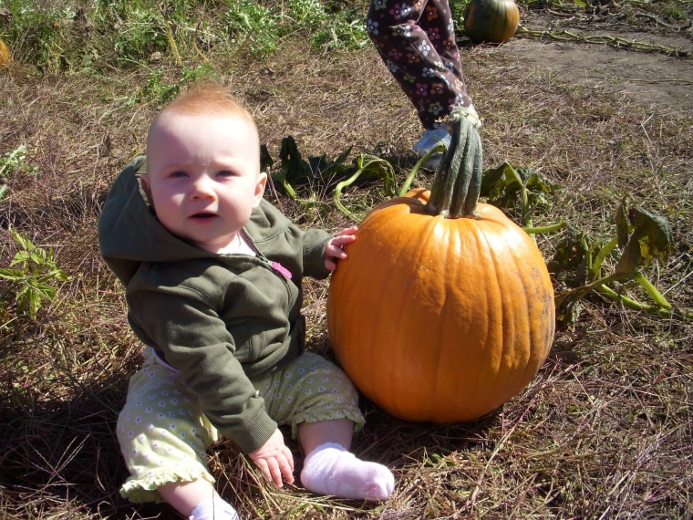 9-month-old Claire's first pumpkin!