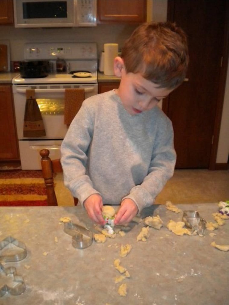 To the mixing bowl, and beyond! 3-year-old making sugar cookies and burying Buzz Lightyear in the dough.