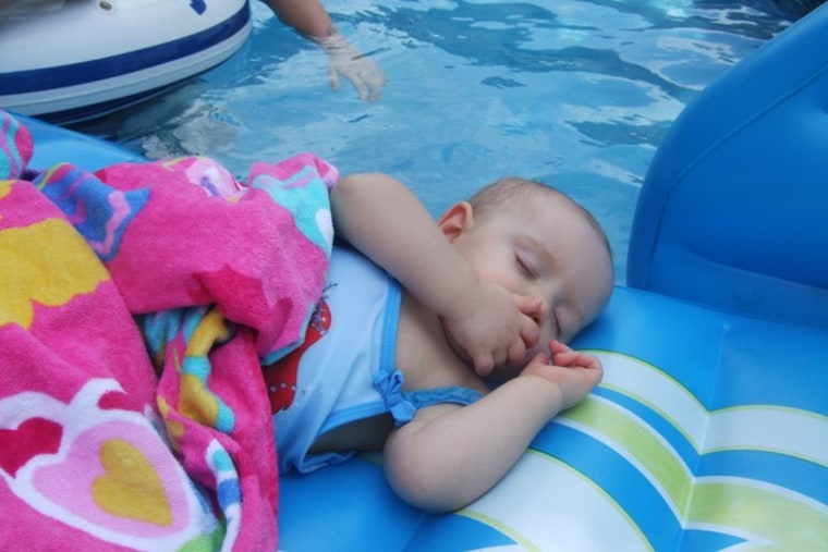 Hadley taking a siesta on a pool floaty.